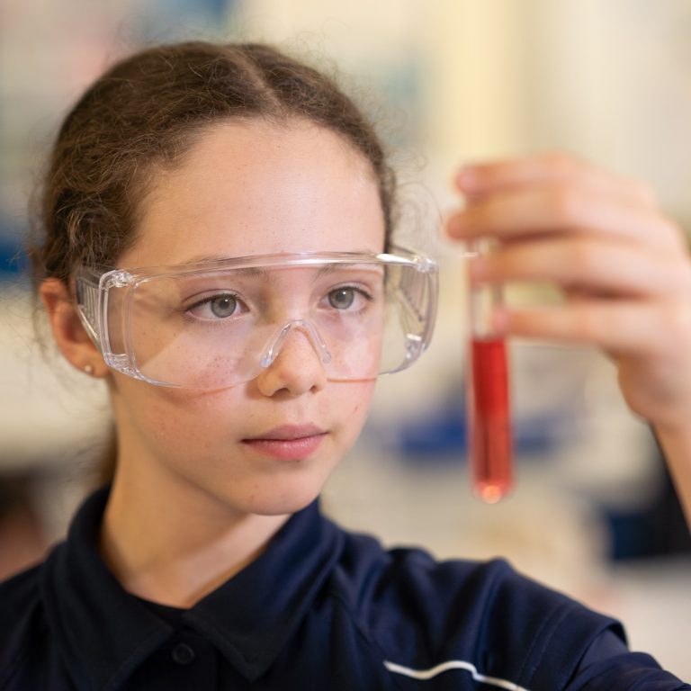 girl holding a test tube