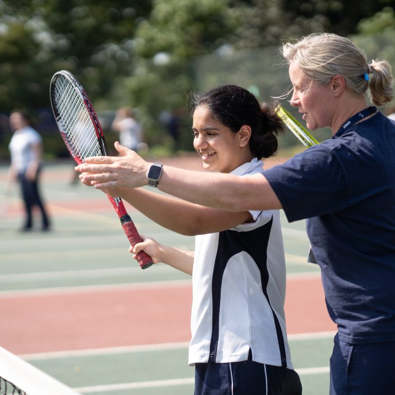 Queen's Gate Senior School girl having tennis lesson in Battersea Park