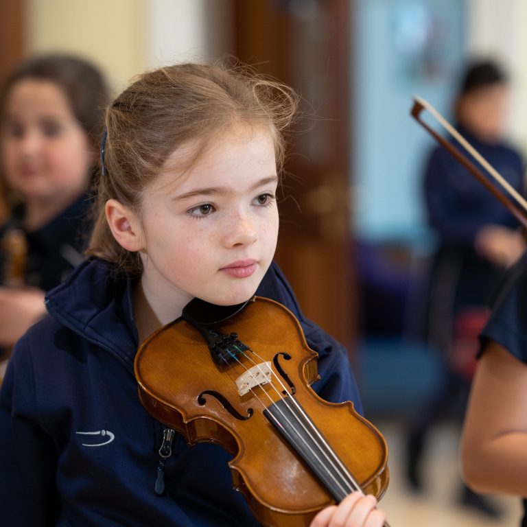 Queen's Gate Junior School girl playing the violin