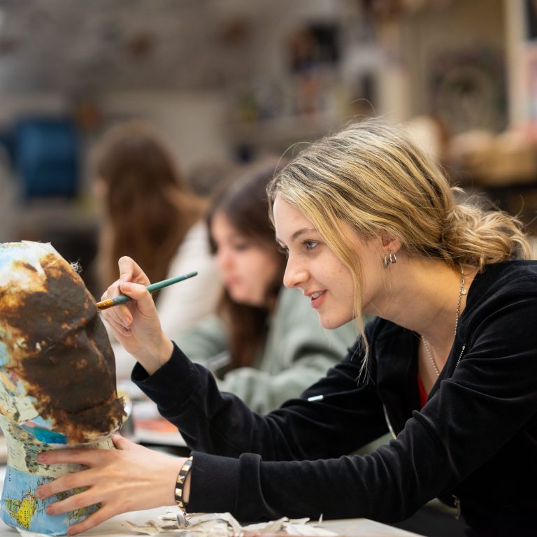 Queen's gate sixth former in art room painting