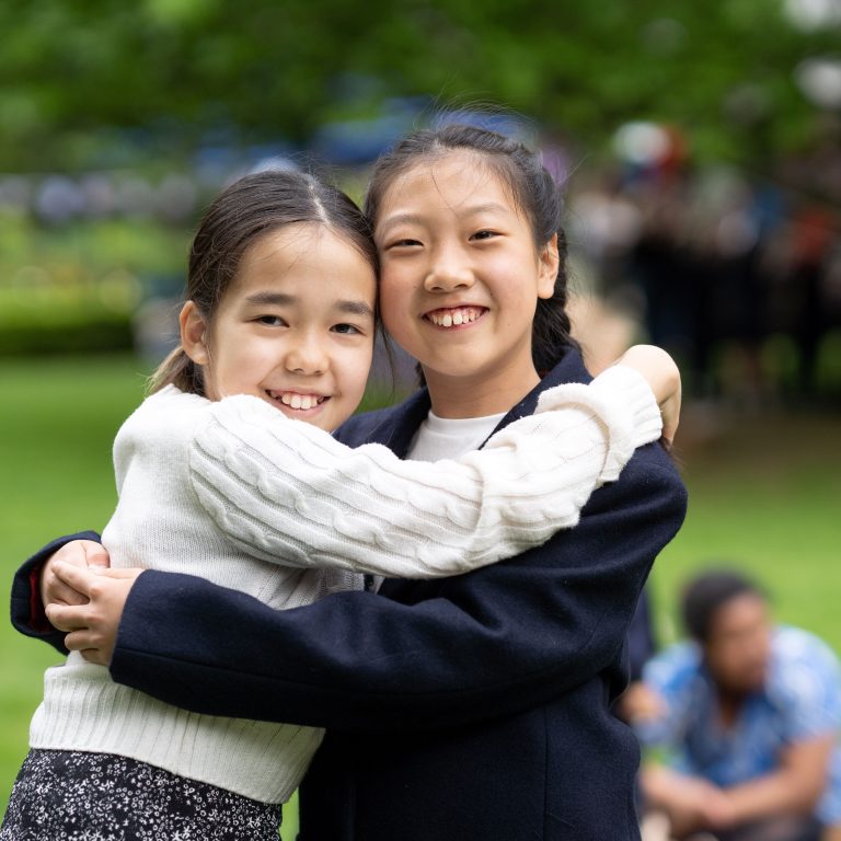 girls hugging each other