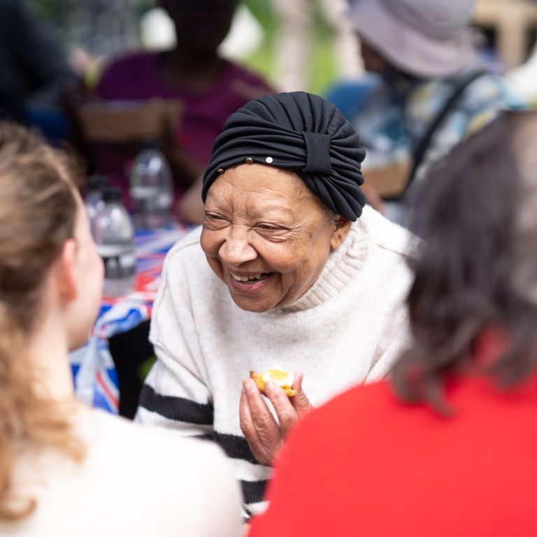 lady smiling at students