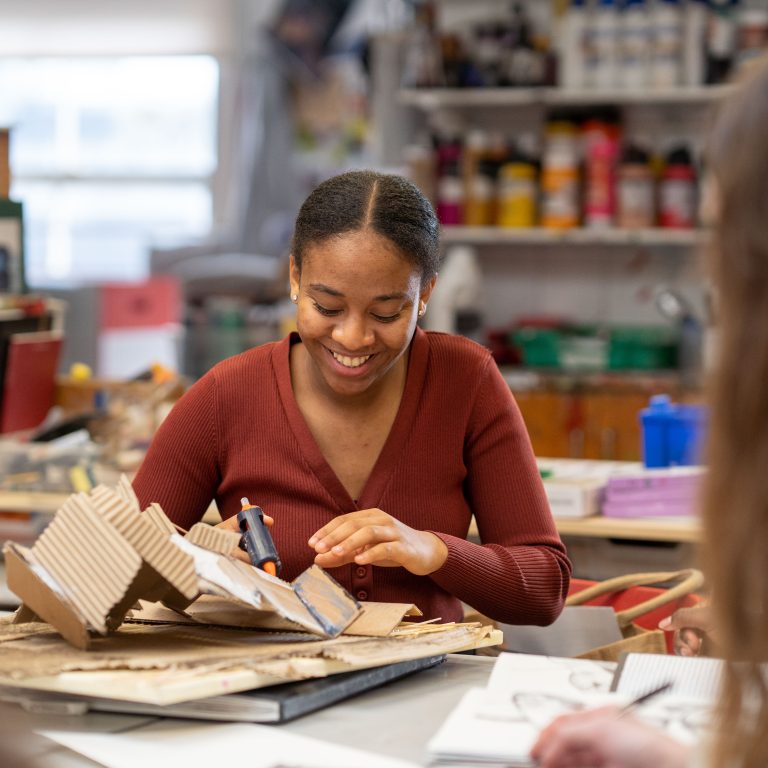 Queen's gate Sixth former in the art room