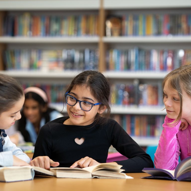 Queen's Gate Junior School girls in the library